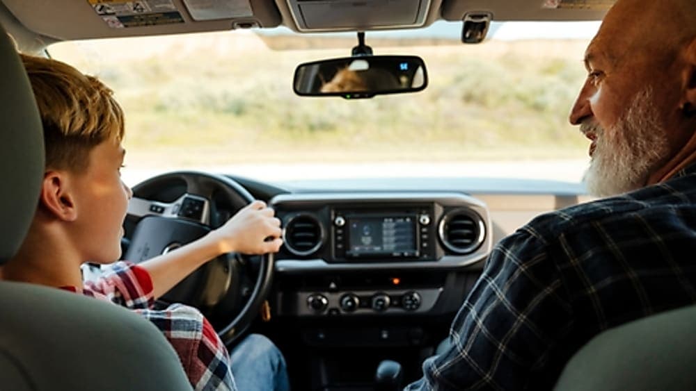 Young driver safely learning how to drive